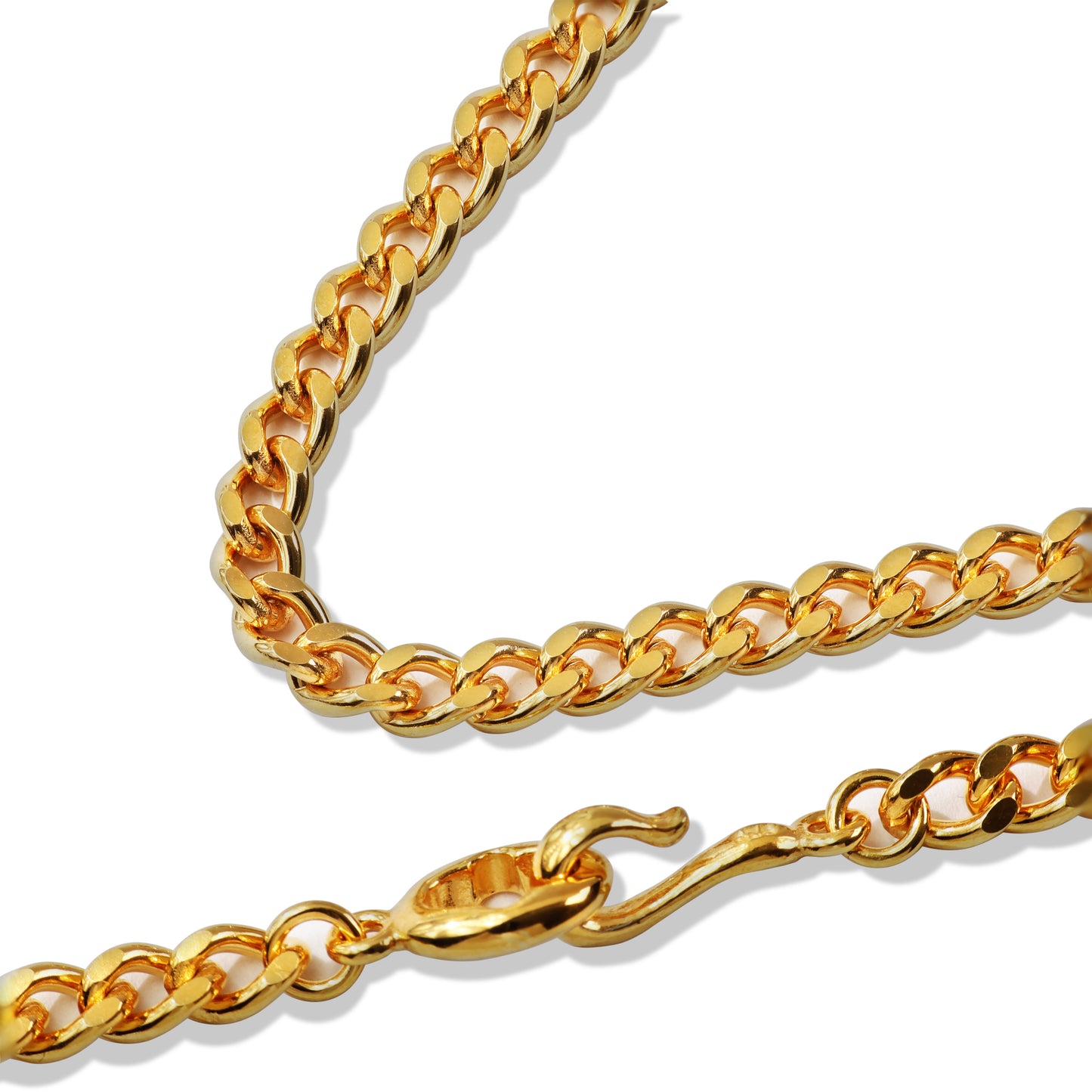 Layered gold chain necklace on black display bust