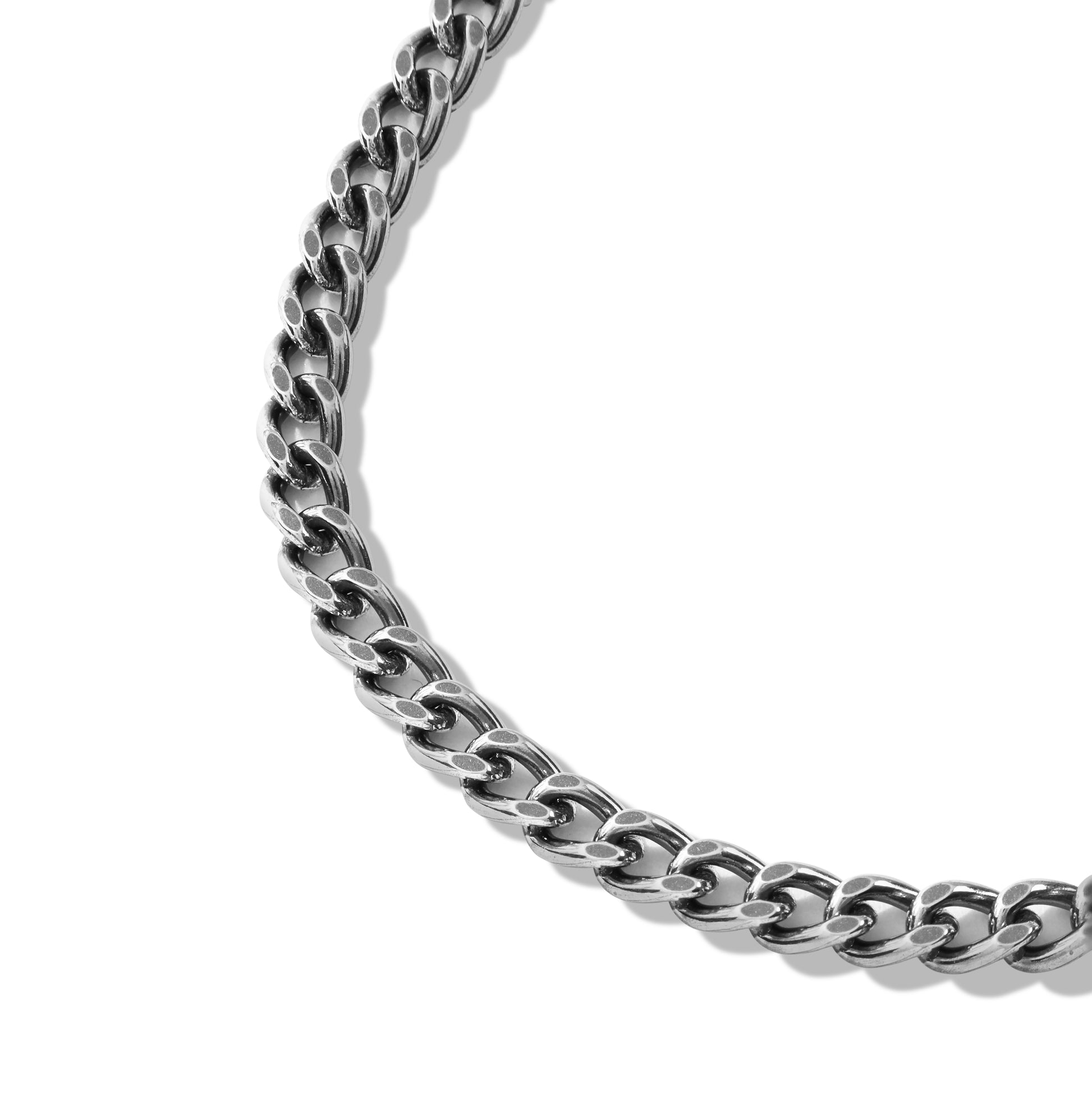 Layered silver chain necklace on black display bust